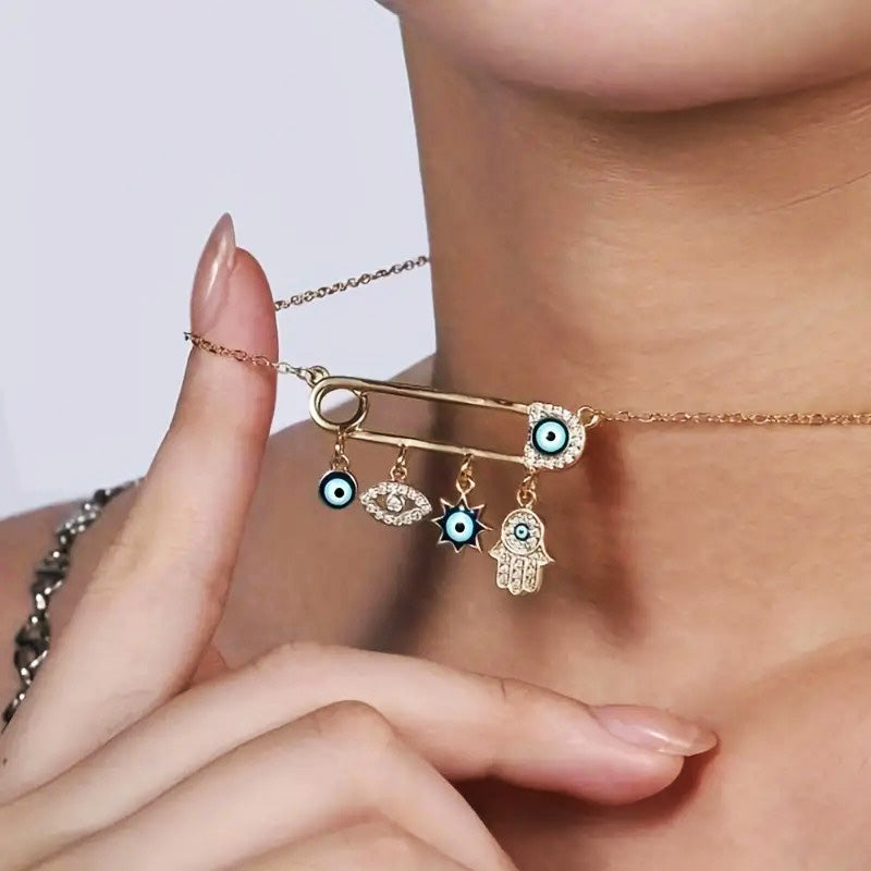 Dainty women's gold plated necklace with a protective Evil Eye charm, adorned with small zircon gems.