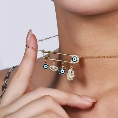 Dainty women's gold plated necklace with a protective Evil Eye charm, adorned with small zircon gems.