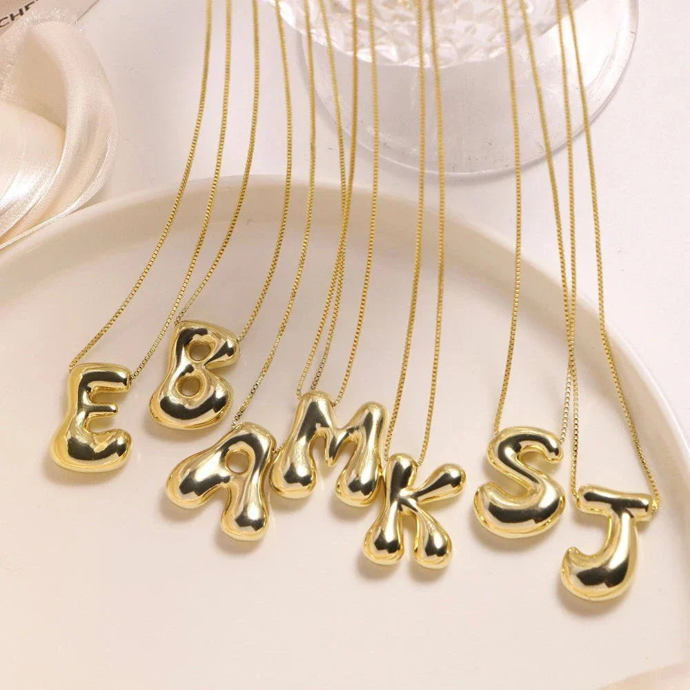 Women's stainless steel gold-tone initial necklace, ideal personalized gift, sleek for everyday wear.