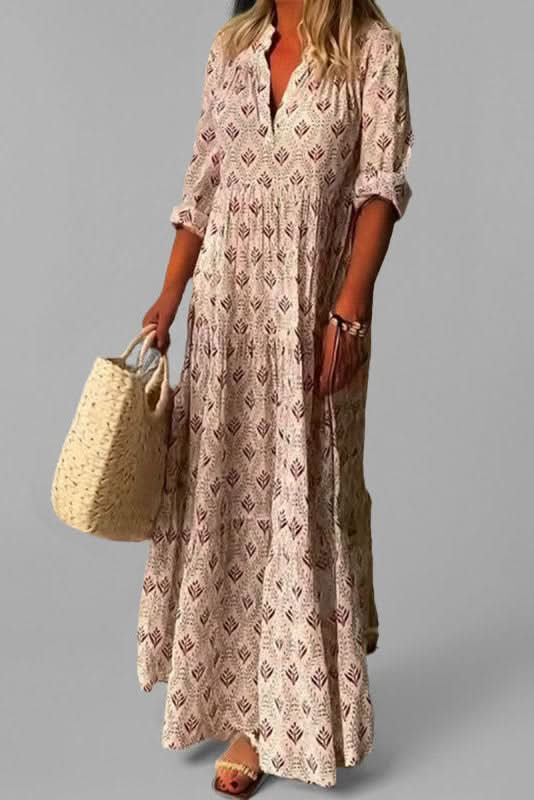 Graceful pink tiered maxi dress for women. Flowing summer style for elegant casual or occasion wear.