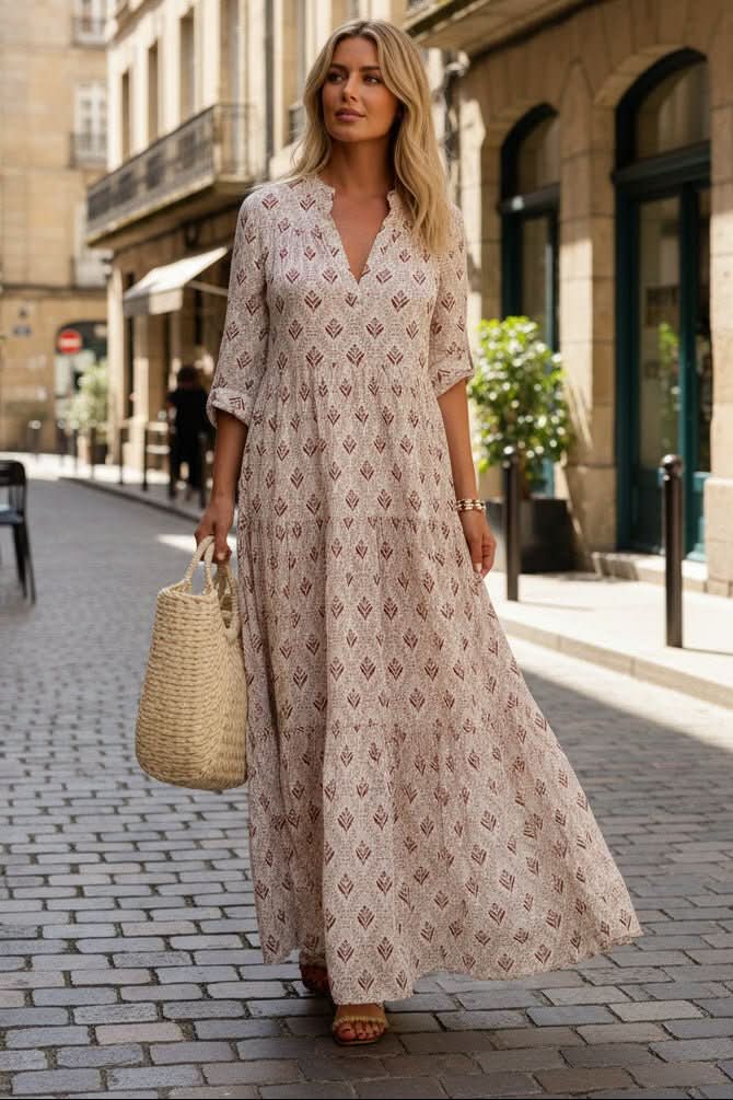 Elegant blue tiered maxi dress for women, with a flowing design. Perfect for summer casual occasions.