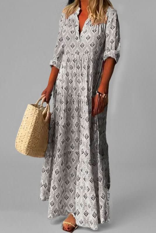Stylish grey tiered maxi dress for women. Effortless flowing summer wear, suitable for any casual occasion.