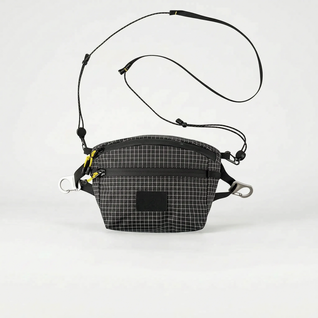 Compact gray travel fanny pack, a versatile grid pattern chest bag for essentials.
