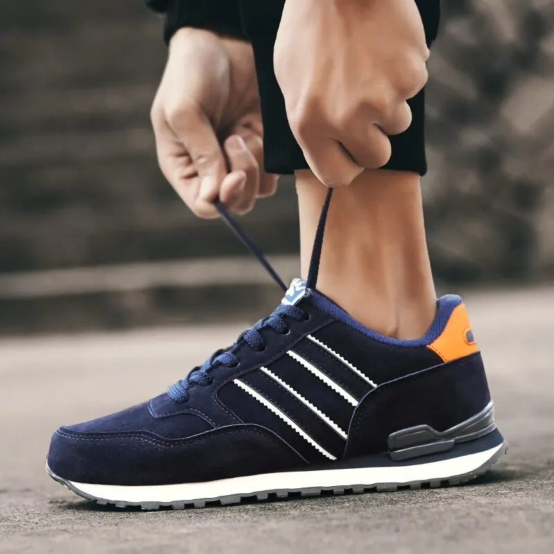 Gray and blue everyday women's comfort sneakers. Cushioned, breathable, and lightweight lace-up walking shoes.