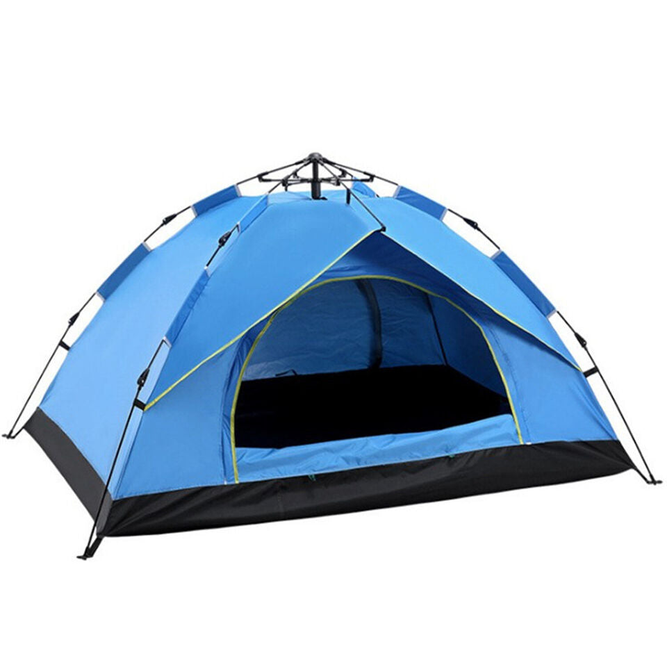 Green waterproof pop-up tent pitched in a forest, blending with nature for outdoor shelter