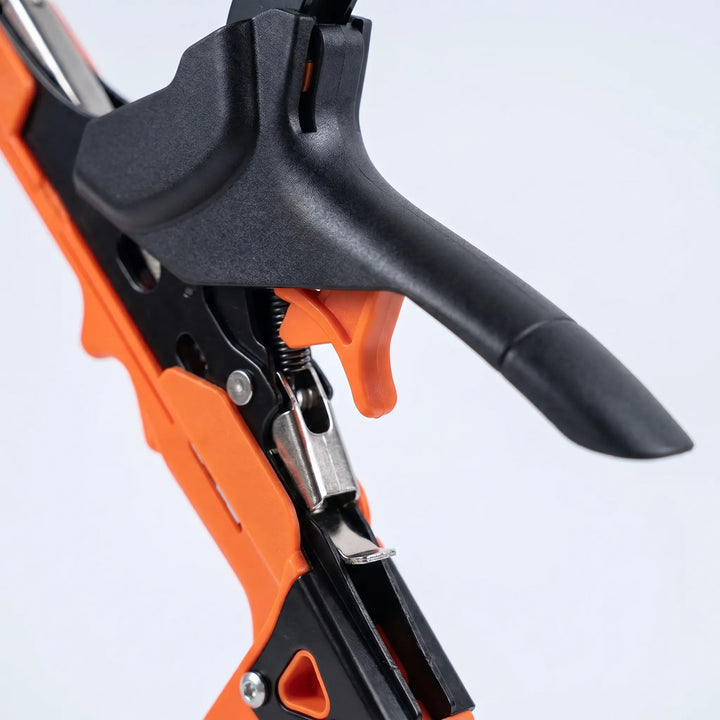 Close-up of a manual plant trellising machine, showing the tape & staple mechanism for efficient vine support.