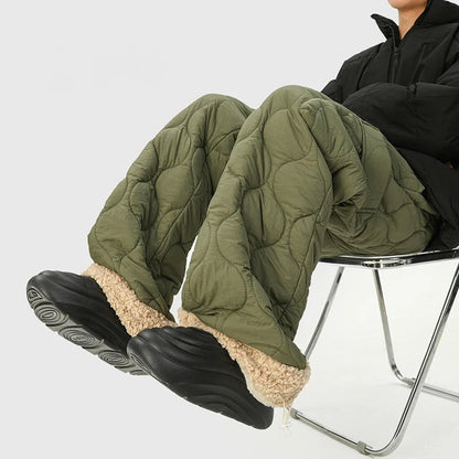 Green men's insulated quilted winter trousers with relaxed fit & adjustable cuffs for cold weather comfort.