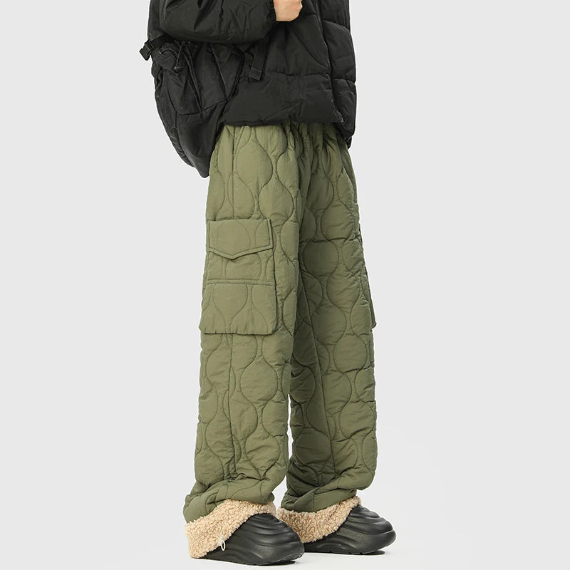 Relaxed fit men's insulated quilted trousers with adjustable cuffs, offering ultimate winter comfort & warmth.