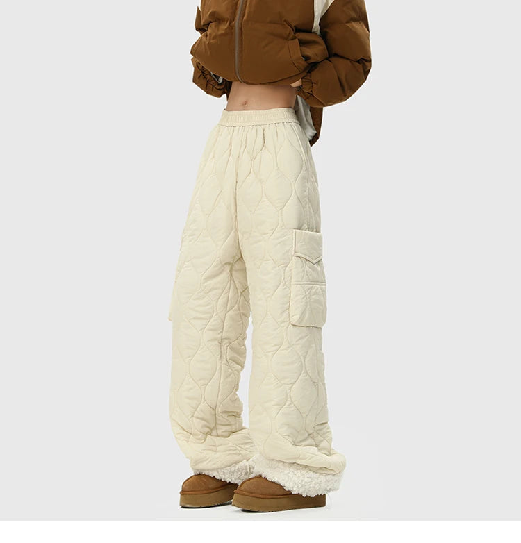 Ivory men's insulated quilted trousers for winter, providing cozy warmth and a relaxed fit for comfort.