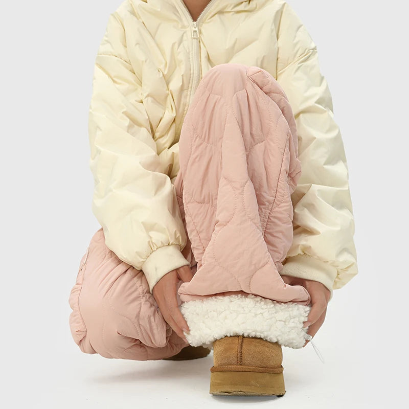 Pink men's quilted insulated winter pants, perfect for cold weather comfort with adjustable cuffs.