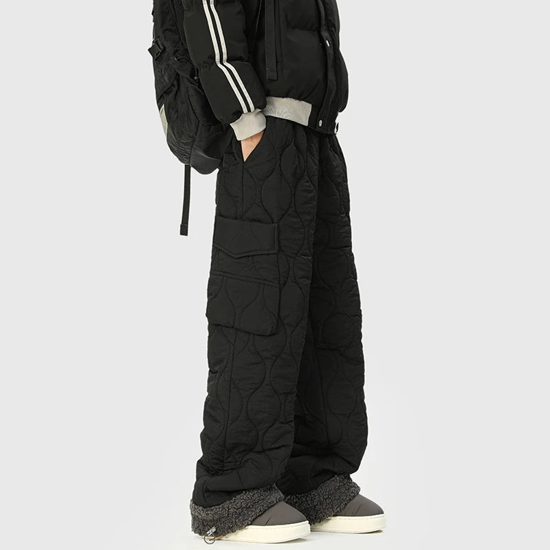 Men's insulated quilted winter trousers, combining warmth with a stylish relaxed fit for cold weather fashion.