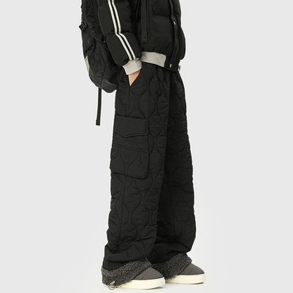 Men's insulated quilted winter trousers, combining warmth with a stylish relaxed fit for cold weather fashion.