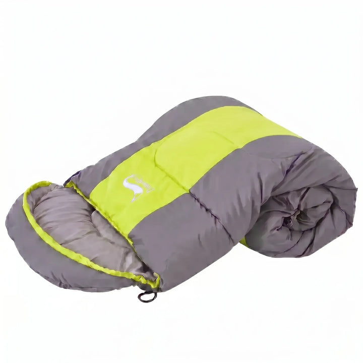 Envelope-style 4-season sleeping bag in vibrant green & orange. Ideal for camping, hiking, and outdoor travel.