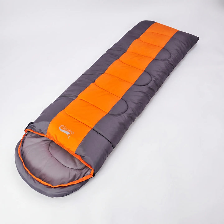 Ultimate 4-season green & orange envelope sleeping bag. Warm, durable, & portable for camping and hiking trips.