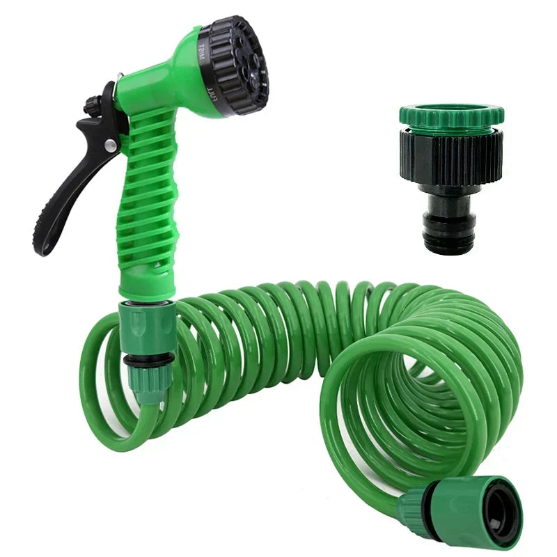Durable green coiled watering hose, tangle-free for efficient garden irrigation & patio cleaning. Retracts for storage.