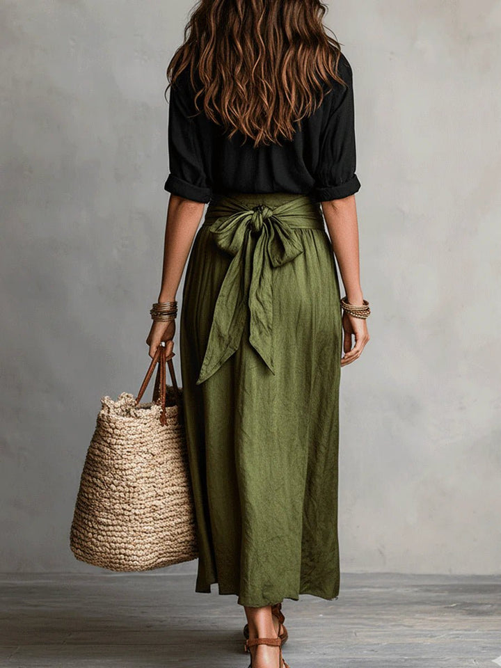 Stylish women's green relaxed two-piece set: button-front shirt & flowing maxi skirt. Casual chic summer resort wear.