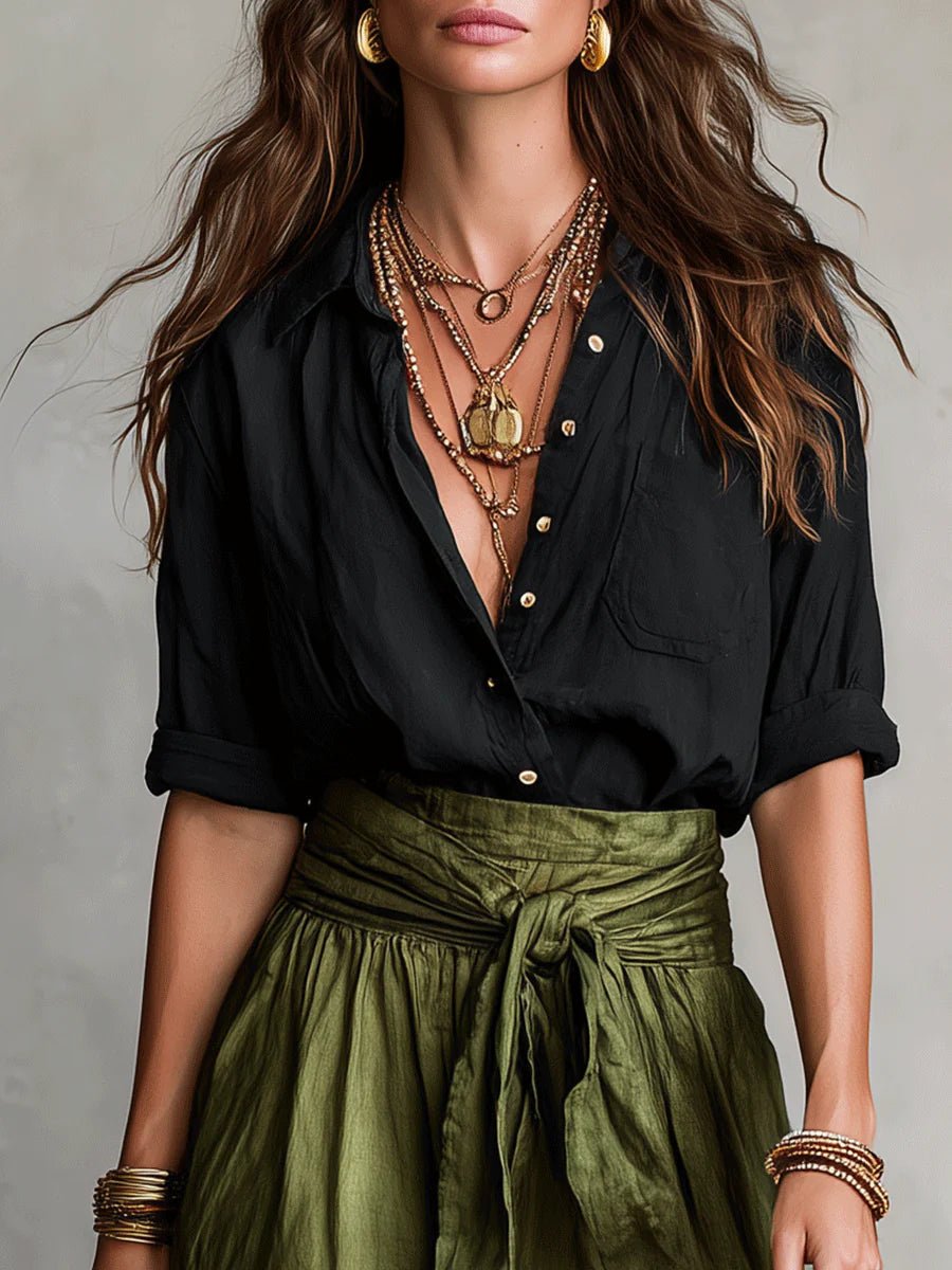 Model wearing a comfortable green women's relaxed button-front blouse and maxi skirt two-piece set. Summer outfit.