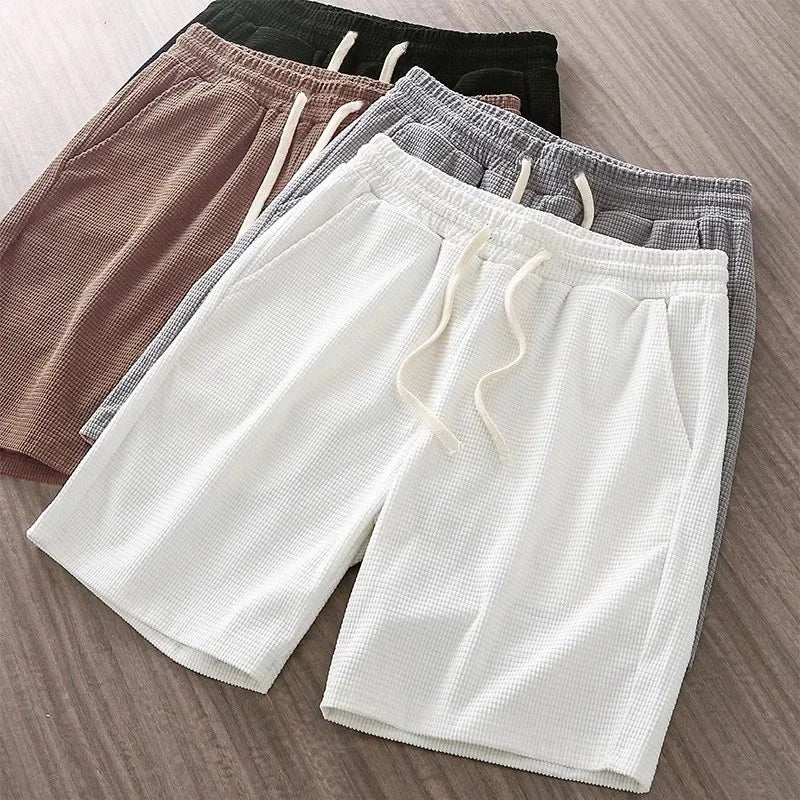 Brown unisex comfortable drawstring shorts, relaxed fit, versatile for summer, everyday outfits, or light athletic activities.
