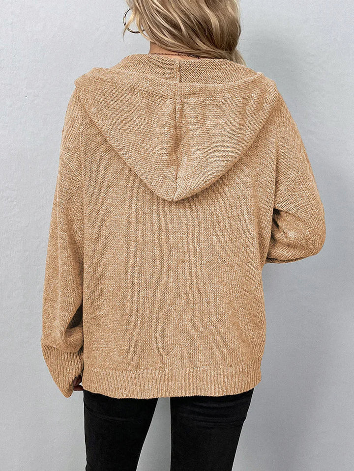Close-up: black women's soft knit cardigan hoodie fabric, ideal for weekends.