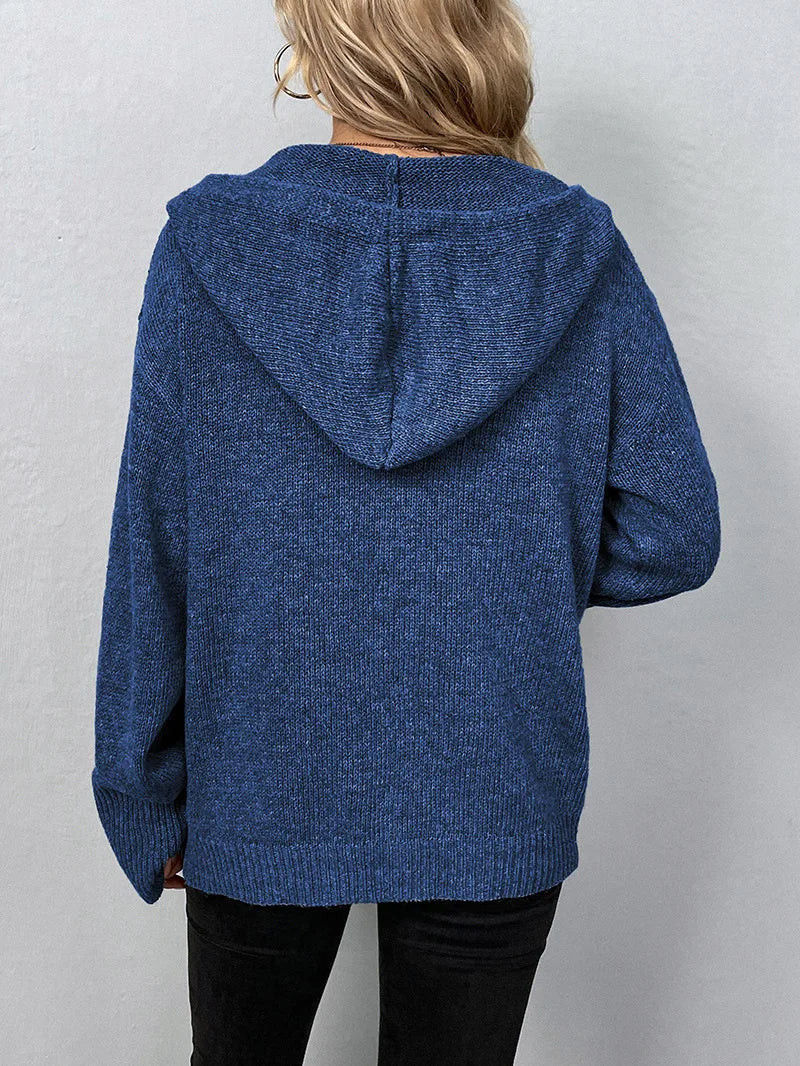 Grey women's versatile weekender cardigan with hood, styled for relaxed comfort.