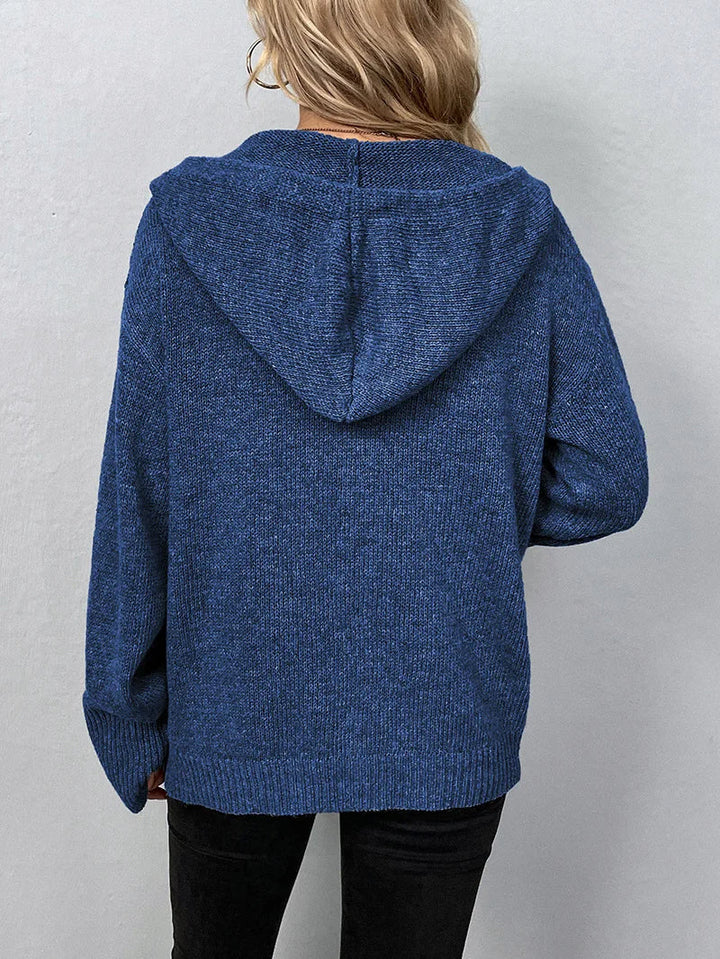 Grey women's versatile weekender cardigan with hood, styled for relaxed comfort.