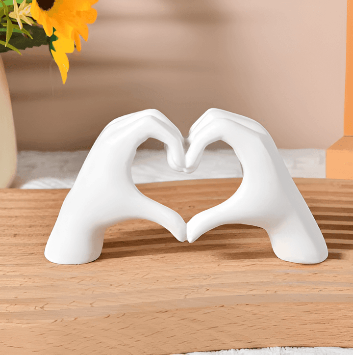 Smooth wooden handcrafted heart hands sculpture, a timeless love symbol and rustic home decor centerpiece.