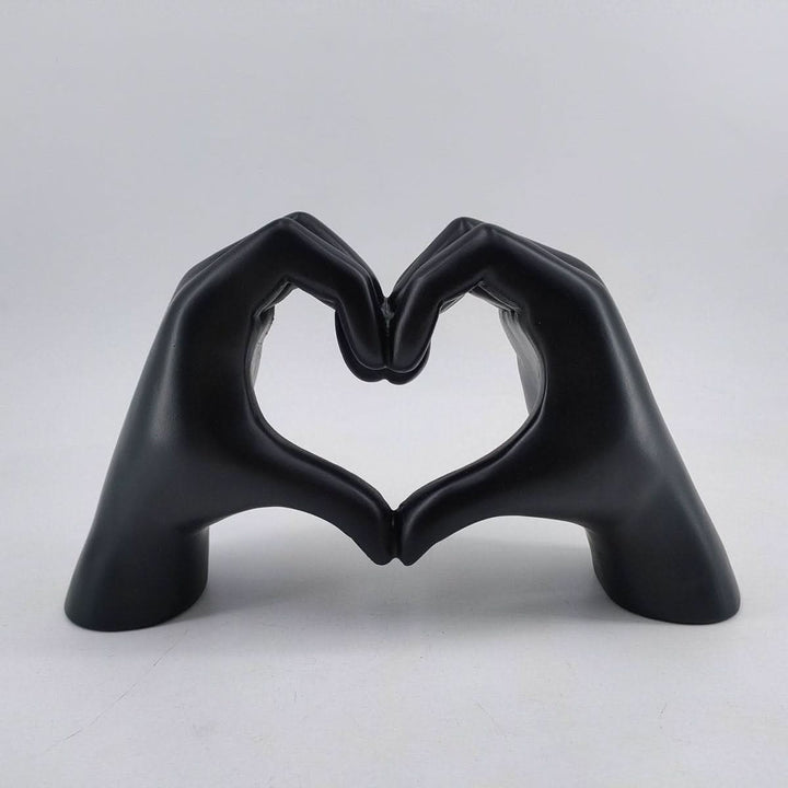Handcrafted wood heart hands sculpture, a rustic and elegant love symbol for modern or farmhouse home decor.