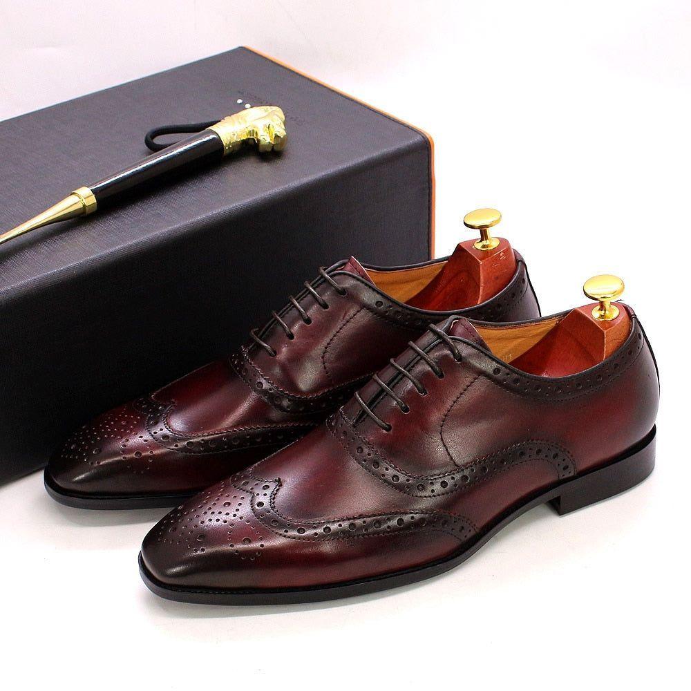 Handcrafted men's wingtip Oxford dress shoes in premium leather, perfect for business and formal occasions.