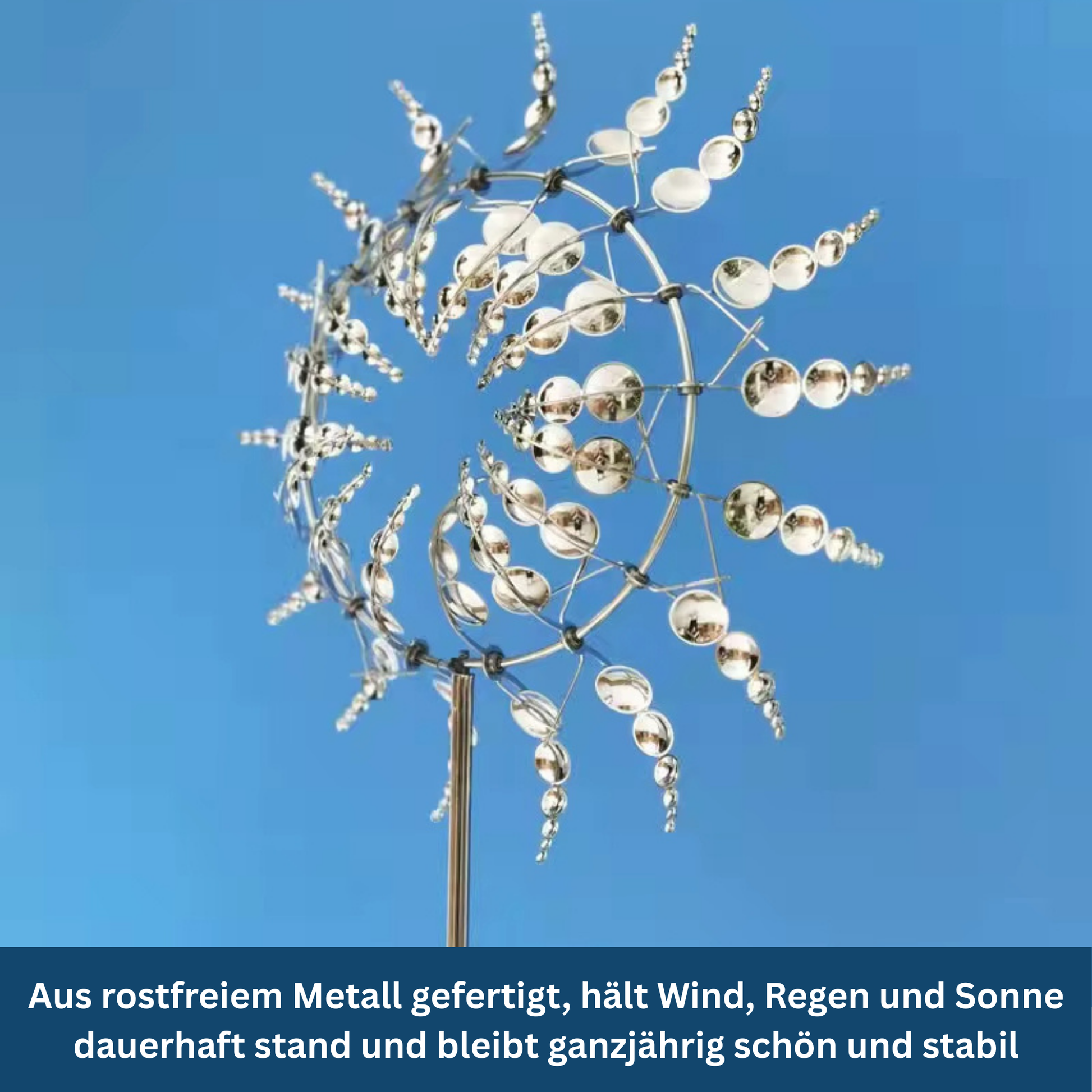 Decorative garden windmill, red and white blades spinning, outdoor lawn ornament