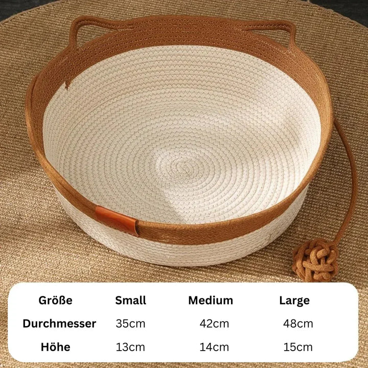 Cozy grey handwoven cotton rope cat bed for comfortable pet lounging. Stylish & durable feline furniture.
