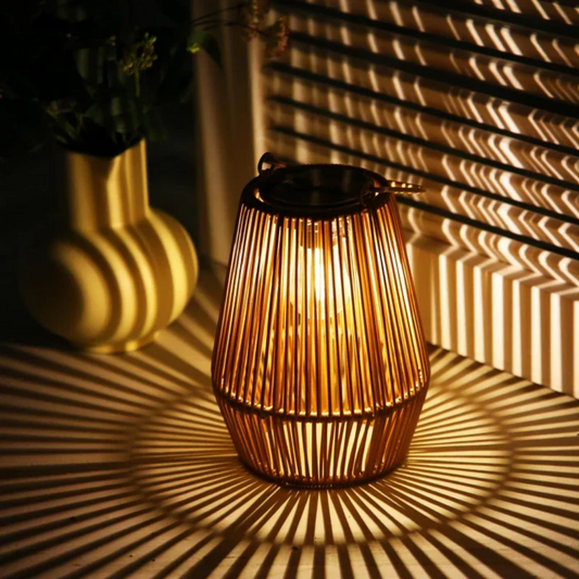 Handwoven solar rattan lantern for garden & patio lighting. Sustainable LED outdoor decor, waterproof.