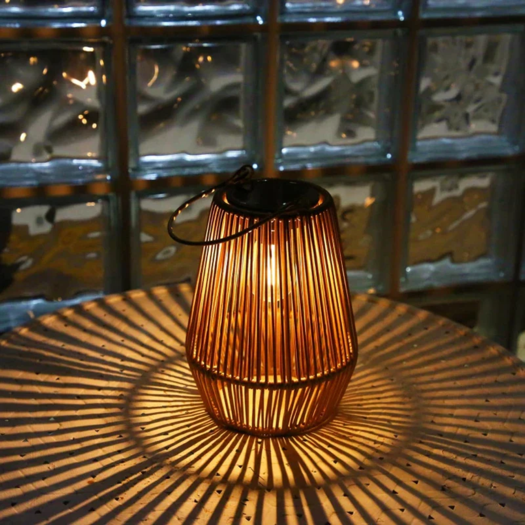Artisan handwoven solar lantern, providing sustainable LED outdoor lighting for garden & patio decor.