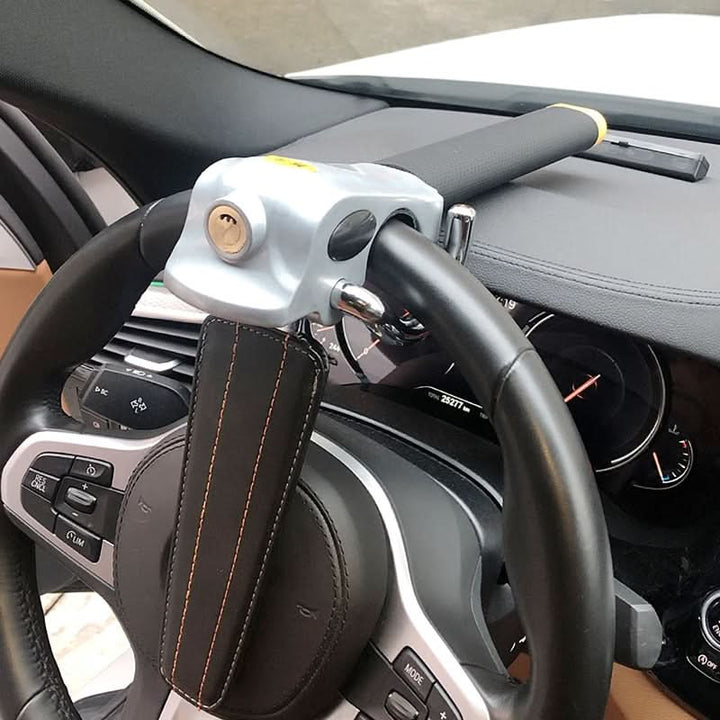 Close-up of a sturdy car steering wheel lock, an essential anti-theft device for enhanced vehicle security.
