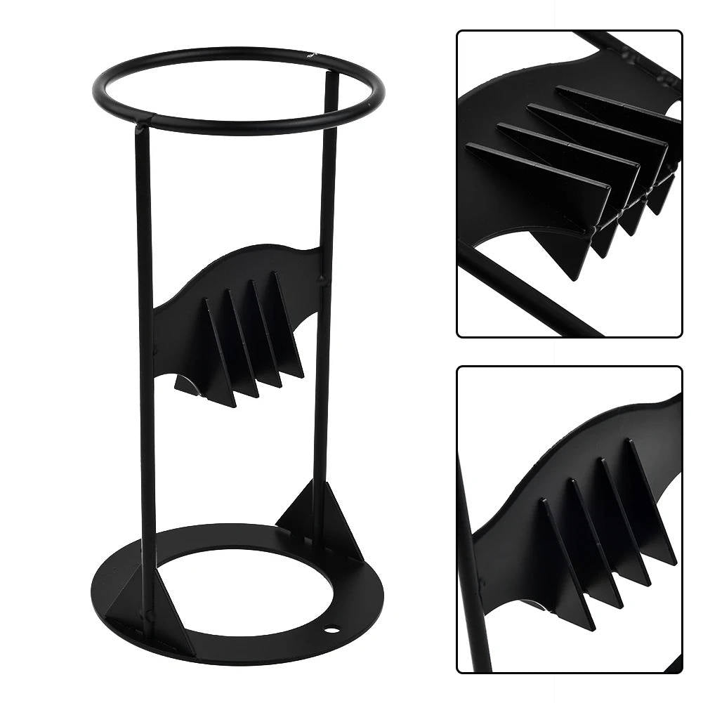 Manual wood splitter for kindling and logs, an essential heavy-duty cast iron tool for outdoor fires.