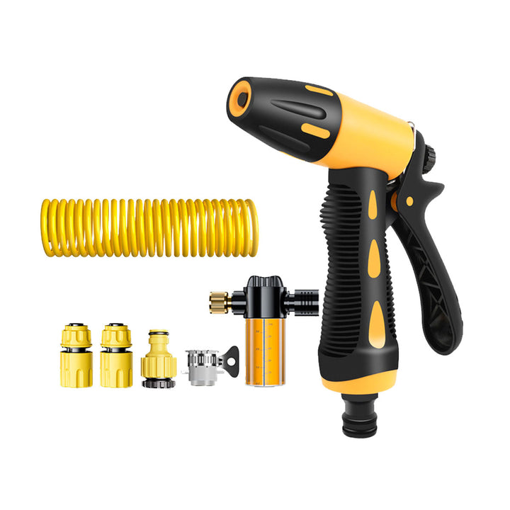 High-pressure water gun attached to coiled hose, demonstrating powerful jet spray for car wash
