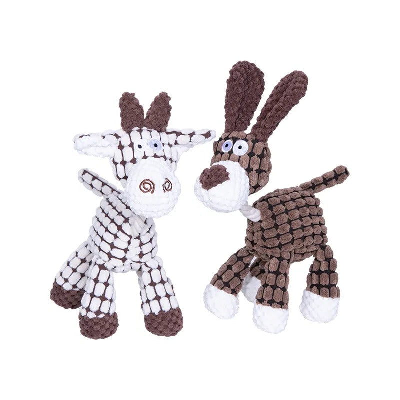 Happy dog actively chewing on a strong, indestructible plush toy. Ideal for heavy chewers, supports dental health.