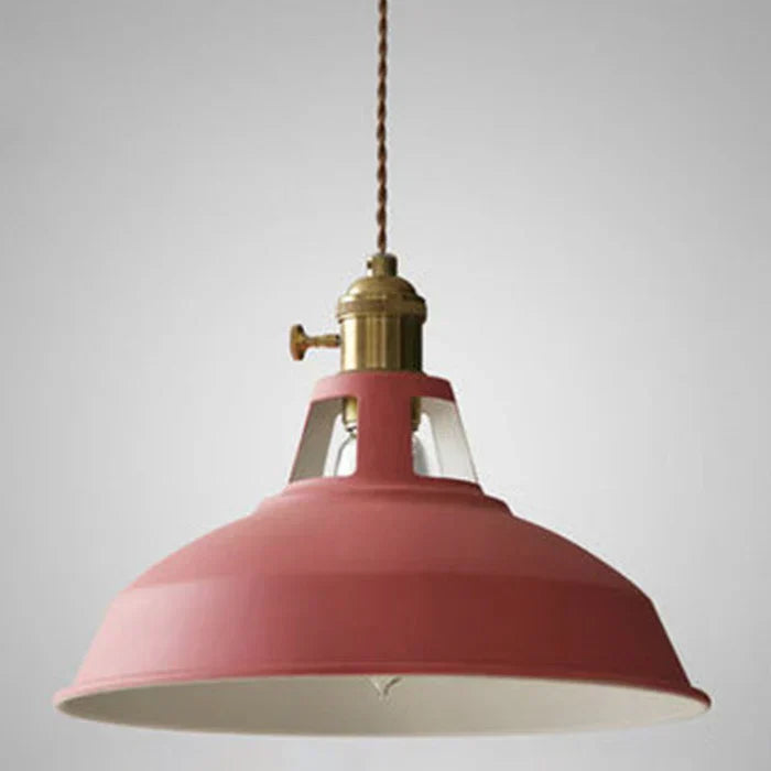 Modern industrial pendant light, gray metal, adds vintage charm to any dining area.