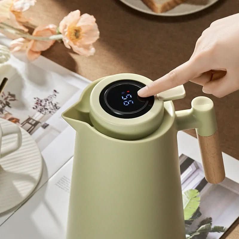 Stylish thermal carafe with a unique wooden handle and clear digital temperature display.