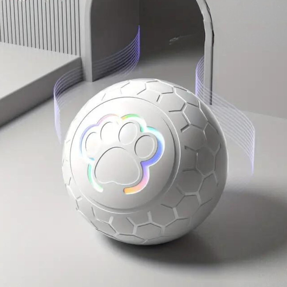 Interactive automatic dog toy ball bouncing on a lawn, perfect for active play and pet enrichment.
