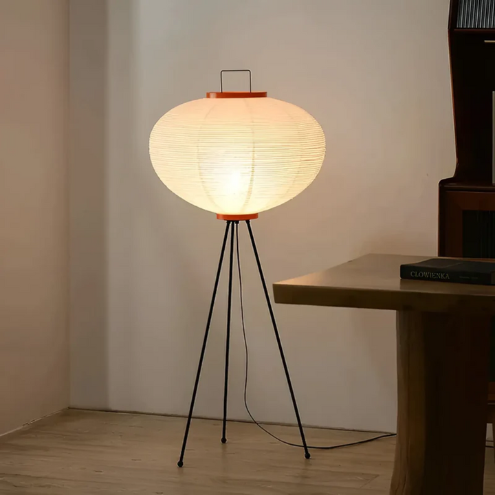 ZenAura Wabi-Sabi rice paper standing LED floor lamp creating a calming ambiance in a modern living room.