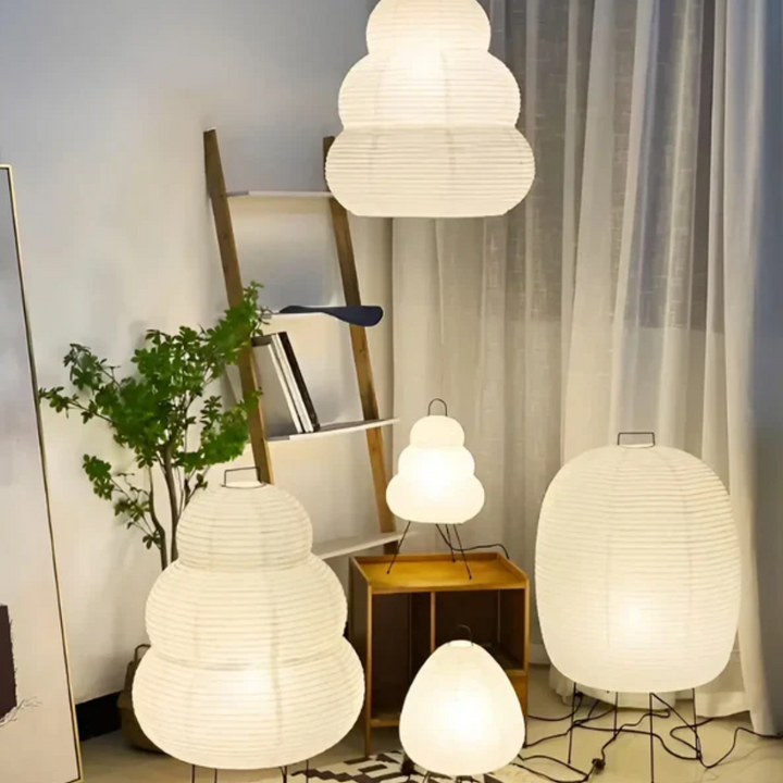 Minimalist Wabi-Sabi rice paper LED standing lamp enhancing bedroom decor with soft, ambient lighting.