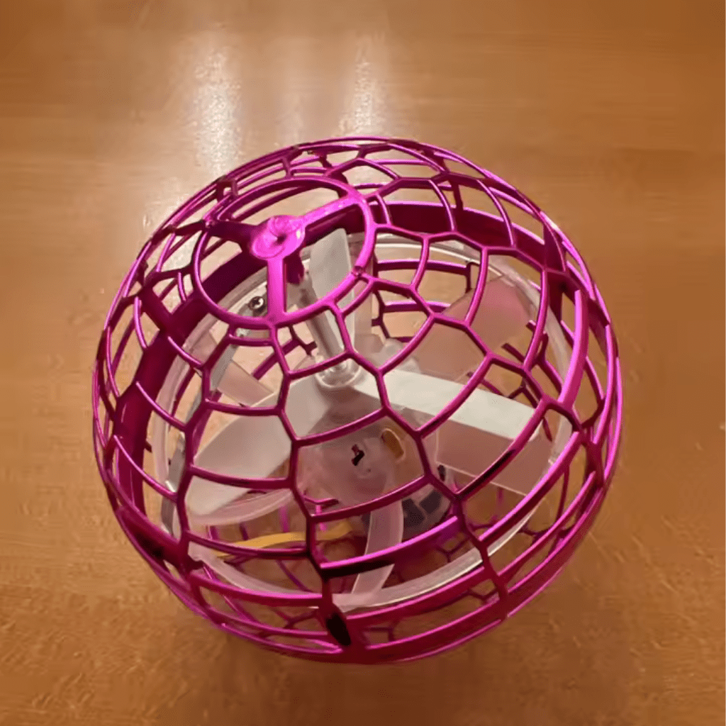 Hand-controlled 360° flying gyroscope, an interactive LED light-up toy for active kids.