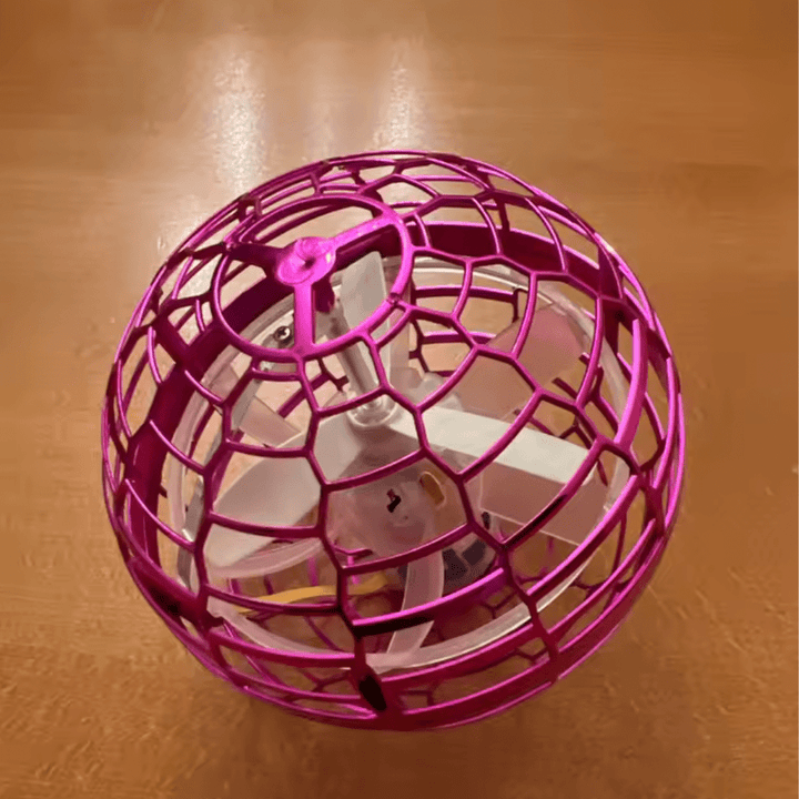Hand-controlled 360° flying gyroscope, an interactive LED light-up toy for active kids.