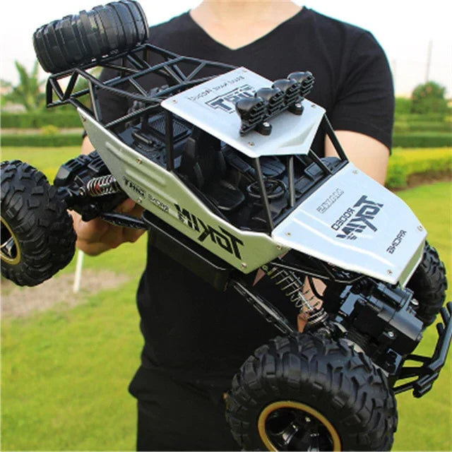 Vibrant 4WD RC Off-Road Monster Truck with remote, rechargeable for high-speed kids' adventures.
