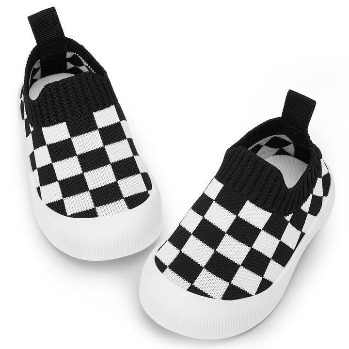 Kids' black & white checkered slip-on shoes, flexible toddler footwear for easy wear & play.
