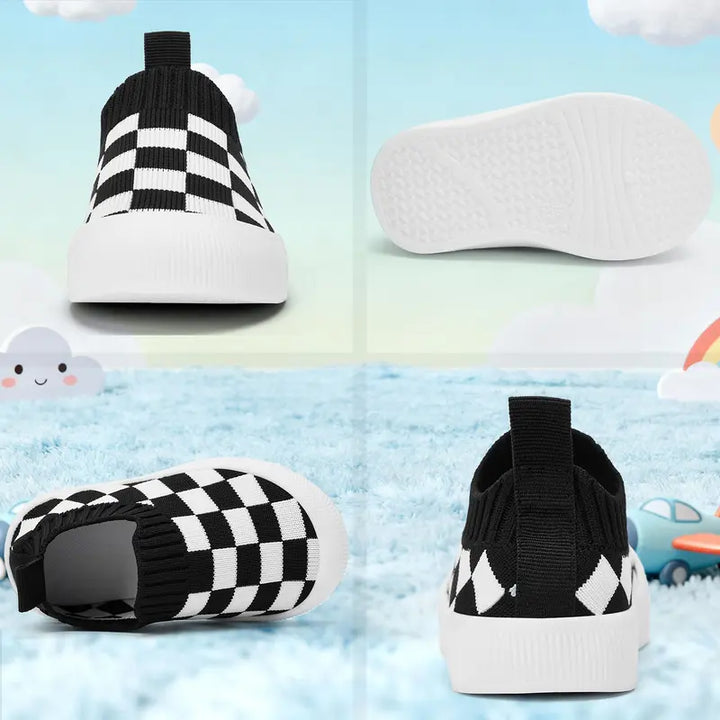 Toddler wearing flexible checkered slip-on shoes, comfortable kids' footwear for running and playing.