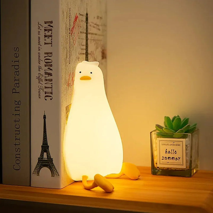 Dimmable animal silicone night light for kids, rechargeable, provides soft glow for nursery sleep aid.