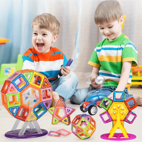 Children playing with a magnetic building block set, fostering creativity & construction skills.