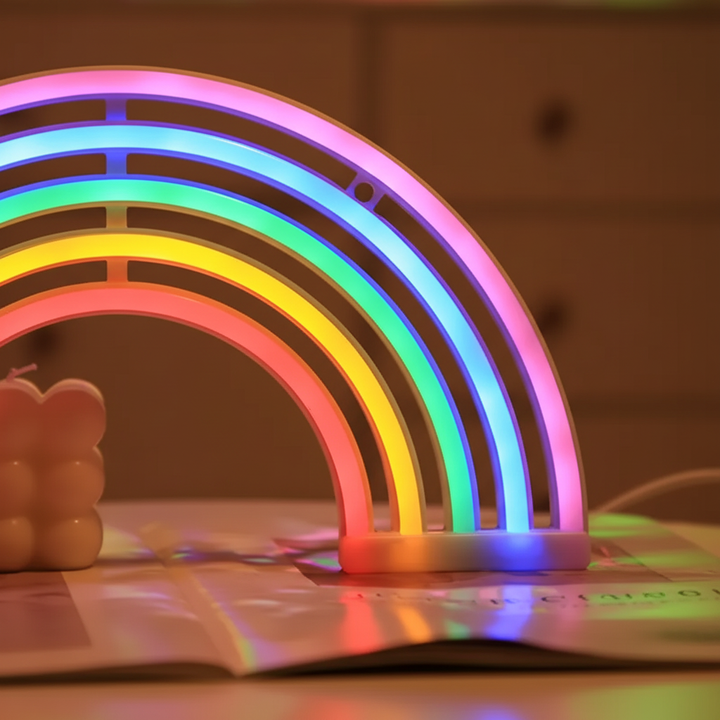 Decorative neon rainbow table lamp adds a playful touch to kids' room decor, offering soft, soothing light.