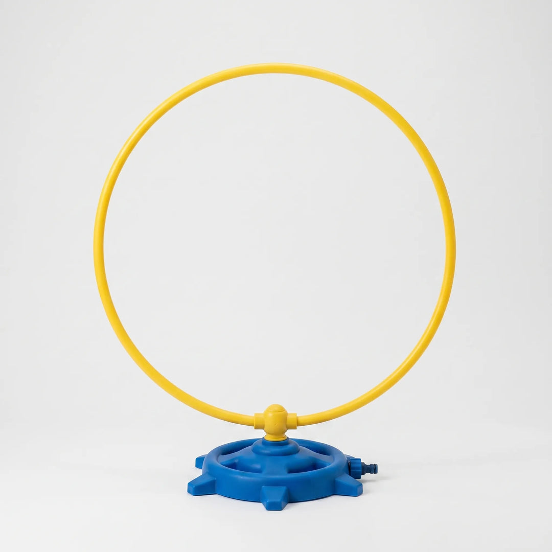 Dynamic rotating water sprinkler, creating a fun water play experience for kids in the garden or backyard.
